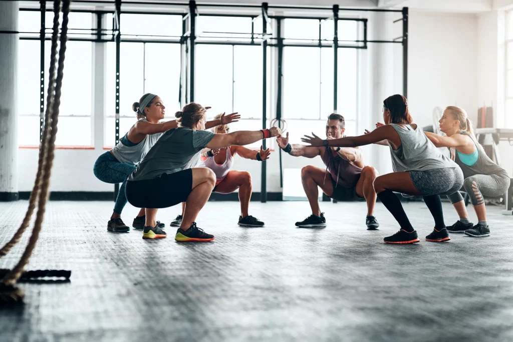 Group members doing excersize in gym