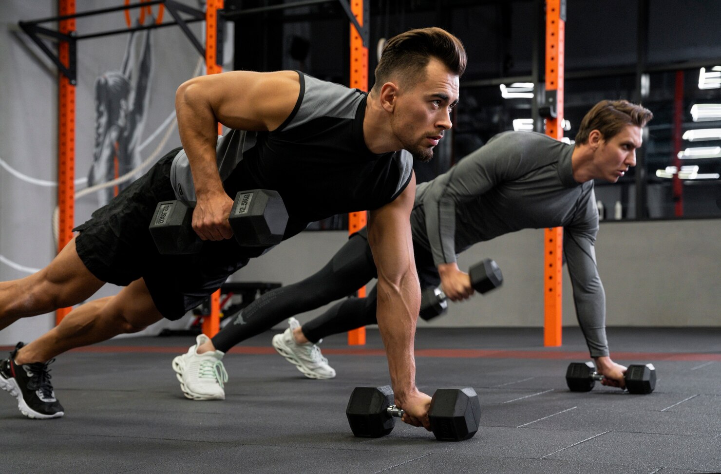 people working out indoors together with dumbbells 23 2149175377